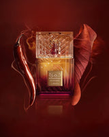lattafa khamrah dukhan perfume bottle phtograph beside pimento and tobacco leaf against red background