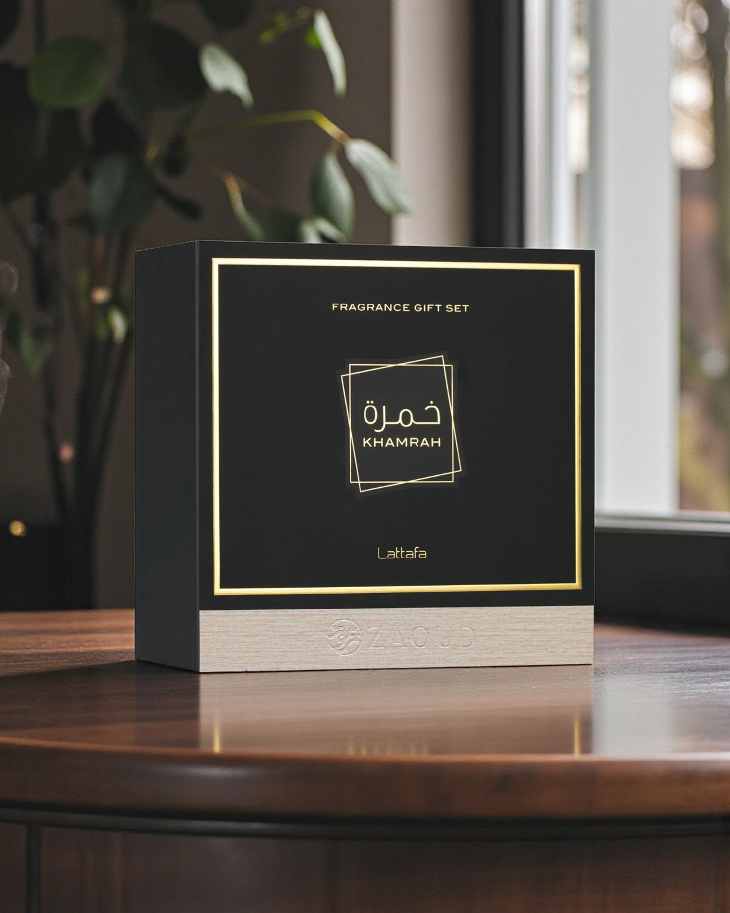 lattafa khamrah giftset box shows over wooden table