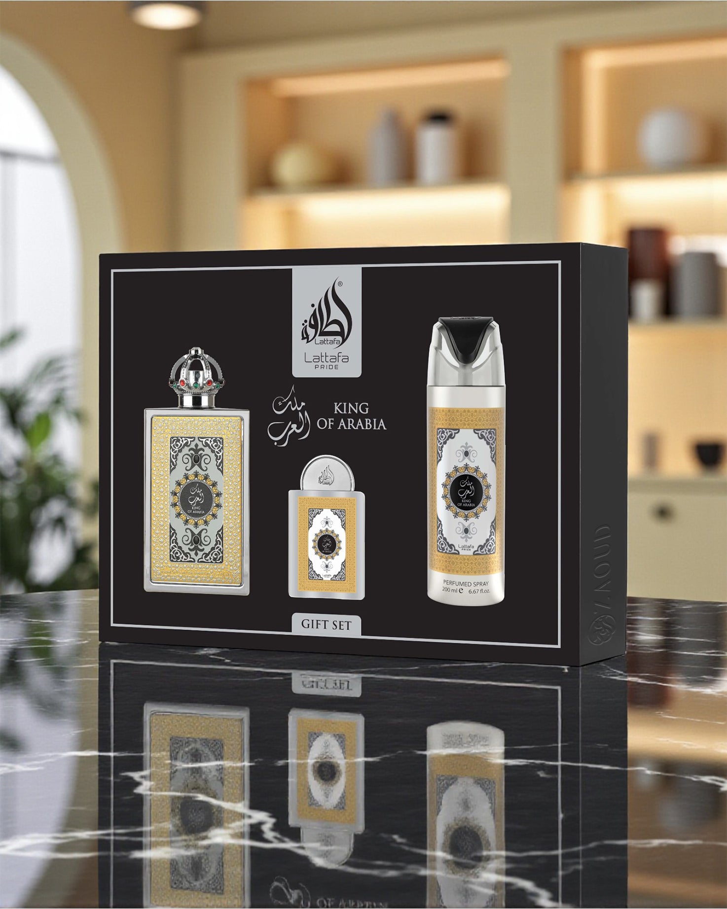 lattafa king of arabia perfume gift set packaging with three perfume bottles on a marble surface.