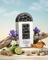 Maharjan Silver Lattafa perfume bottle with flowers and fruits on a beach background