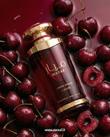 Lattafa Mayar Cherry Intense Eau de Parfum 100ml deep red bottle with gold cap surrounded by fresh dark cherries