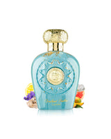 lattafa opulent dubai perfume bottle surrounded with fragrance notes like mango and citrus shows against white background