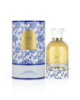 lattafa petra perfume bottle shows beside its box against white background