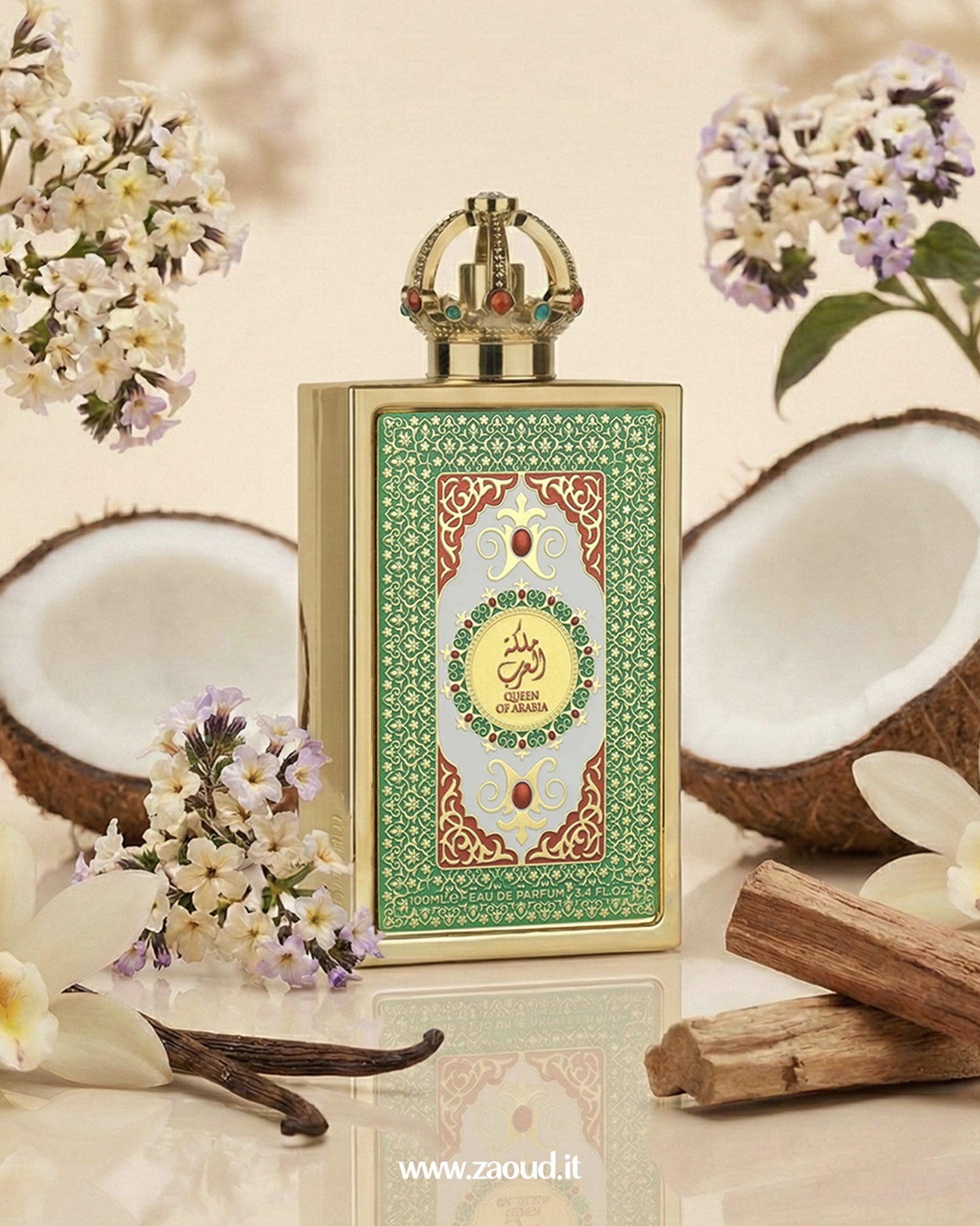 lattafa-queen-of-arabia Perfume bottle with decorative label surrounded by coconuts and flowers on a light background