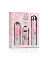 lattafa YARA perfume gift set in a pink patterned box, containing a perfume spray, eau de parfum, and air freshener in matching pink bottles with silver caps.
