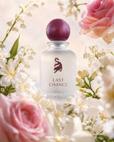 Laverne Last Chance Eau de Parfum bottle surrounded by pink roses, lily of the valley, and white jasmine flowers, showcasing a soft floral musk fragrance with romantic feminine elegance.