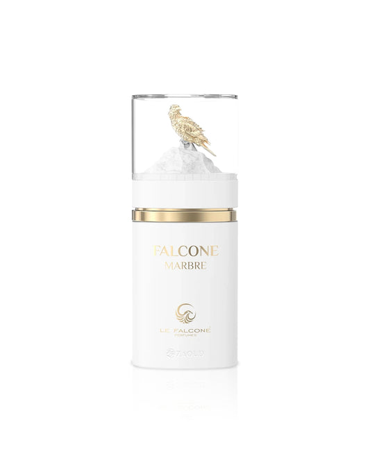 le falcone marbre White candle with gold lid and decorative element on a white background