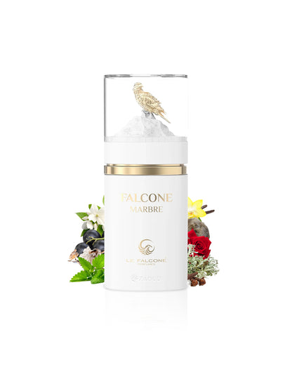 le falcone marbre White candle with gold lid featuring 'falcone Marbre' branding on a white background with decorative elements like mint and cloves.