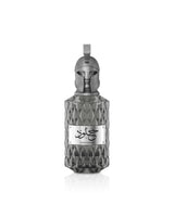 le falcone khulood Decorative bottle with geometric design and a label on a white background
