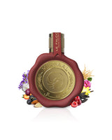 le falcone mirsaal love letter Red and gold perfume bottle with floral elements like almond and cherry on a white background