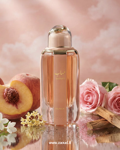 mahab-by-nusuk Perfume bottle with peach, roses, and flowers on a soft pink background