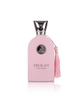 A pink perfume bottle with a silver cap and a pink tassel, labeled 'DELILAH POUR FEMME', on a white background.