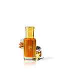 manna angels share perfume oil bottle shows with vanilla behind the bottle