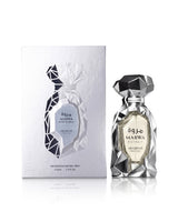 marwa extrait perfume bottle shows beside its packaging against white background
