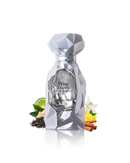 marwa extrait perfume bottle surrounded with fragrance notes like cinnamon and citrus shows against white background