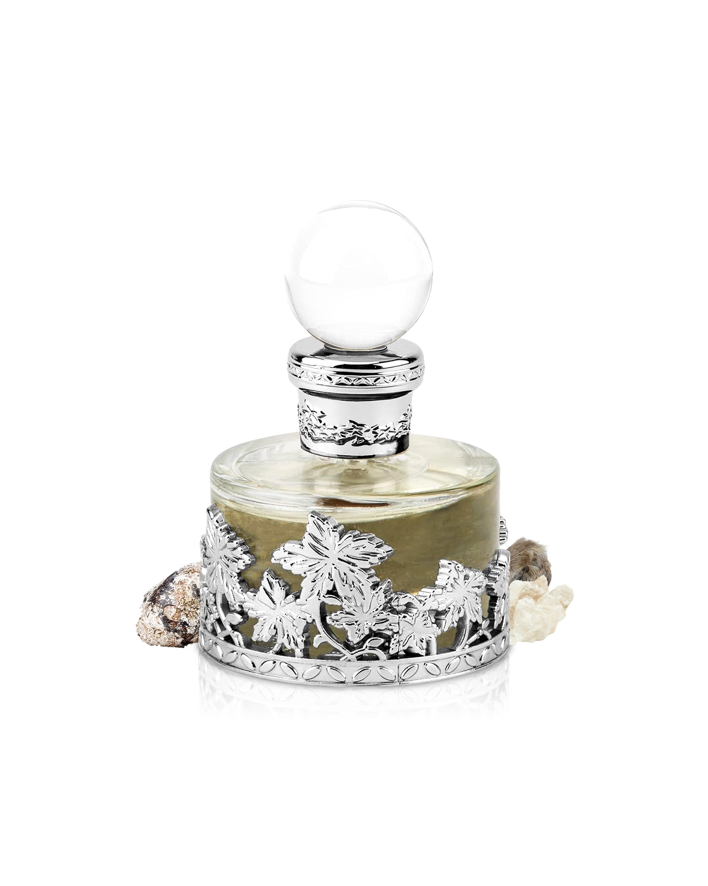 swiss arabian musk malaki perfume oil bottle surrounded with its ingredients like ambergris and musk shows from behind the bottle against white background