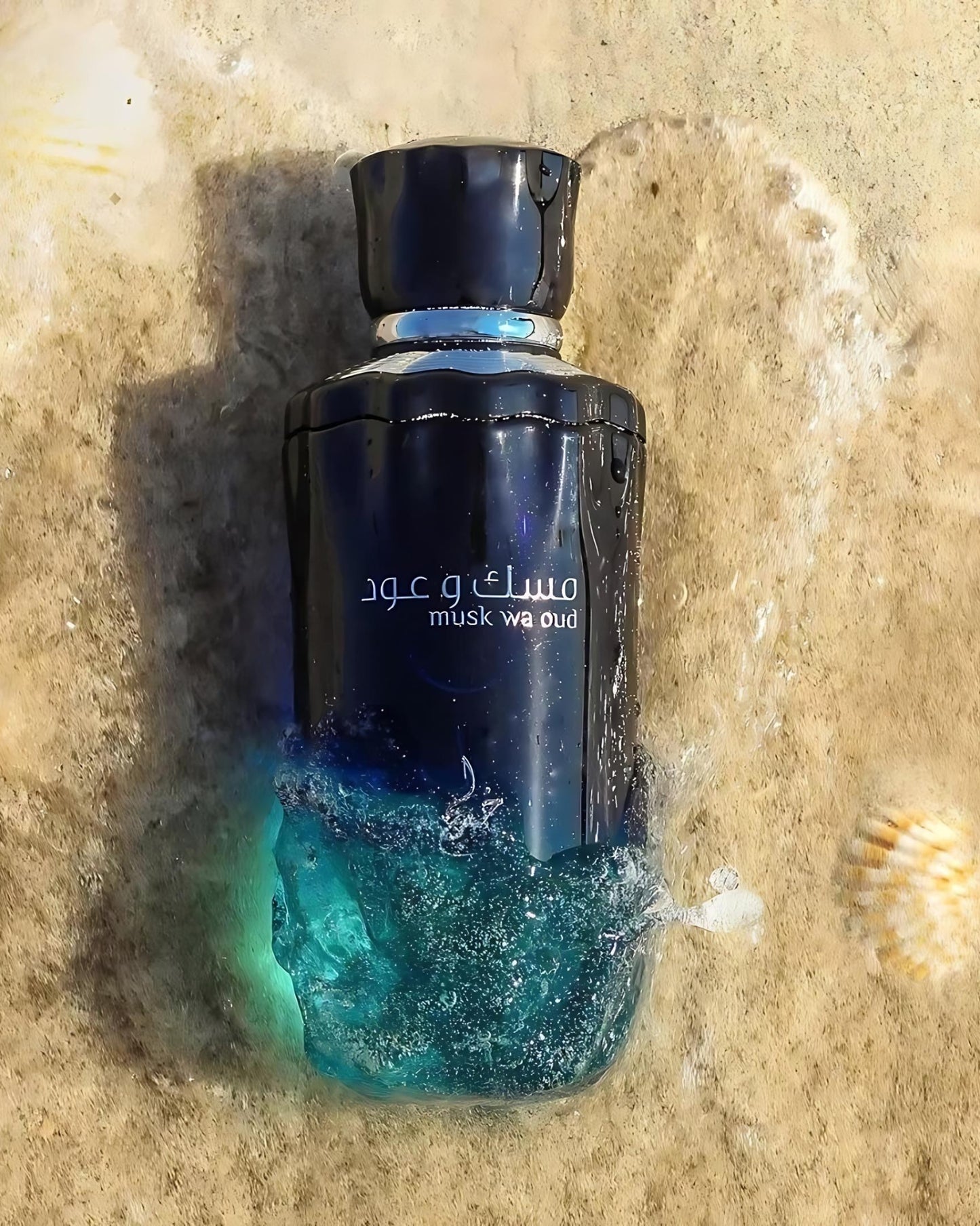 musk wa oud by khadlaj perfume bottle photograph under water at beach beside a sea shell over sands