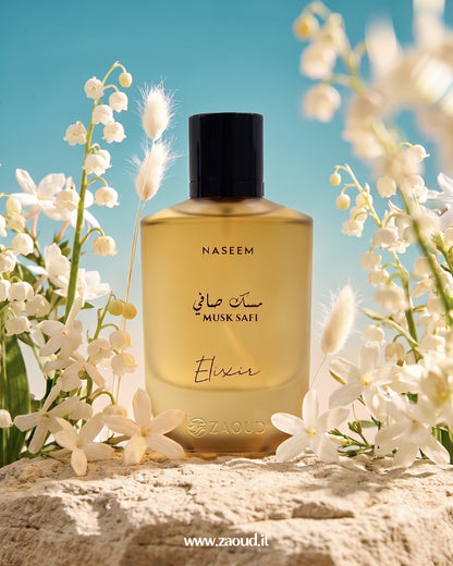Naseem Musk Safi Elixir perfume bottle surrounded by white flowers with a blue sky background
