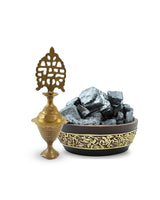 Traditional moroccan Kohl Holder and Kohl Stones in Ornate Bowl on White Background – A Classic Display of Authentic Arabian Makeup Essentials