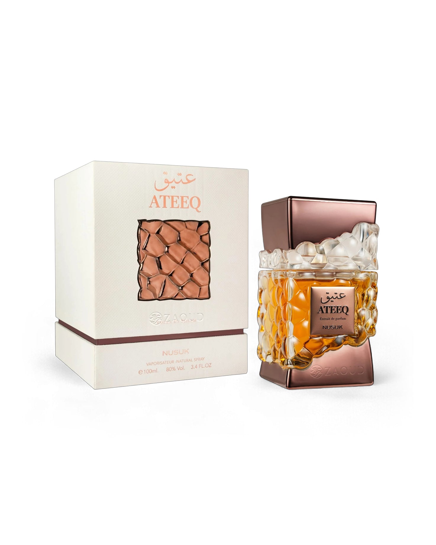 nusuk ateeq perfume bottle shows beside its box against white bckground