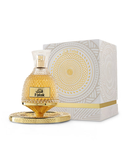 nusuk falak perfume bottle shows beside packaging against white background
