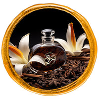 oriental Perfume bottle surrounded by spices and madagascar vanilla