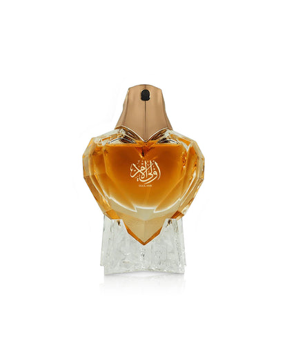ahmed al maghribi oulil amr Perfume bottle with a gold cap and clear base on a white background