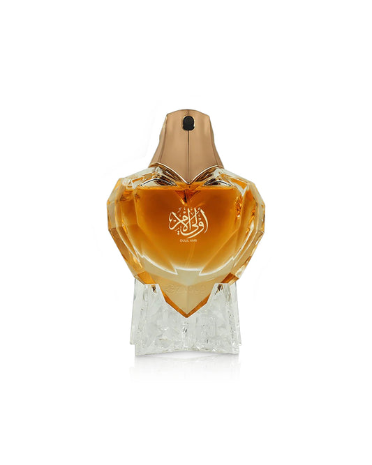 ahmed al maghribi oulil amr Perfume bottle with a gold cap and clear base on a white background