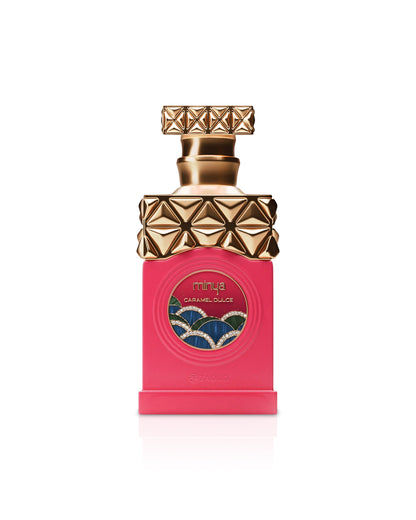 paris corner minya caramel dulce Perfume bottle with gold cap and pink body on a white background