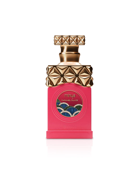 paris corner minya caramel dulce Perfume bottle with gold cap and pink body on a white background