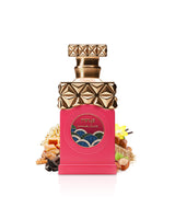 paris corner minya caramel dulce Pink perfume bottle surrounded by chocolate and caramel with gold cap on a white background