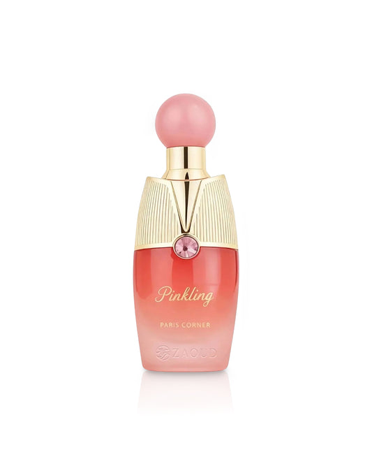 paris corner pinkling perfume bottle shows against white background 