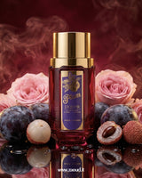 Bottle of Plum Liquor with gold cap surrounded by pink roses and plums on a reflective surface.