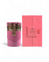 strawberry pound cake Pink perfume bottle with gold accents and matching pink packaging on a white background