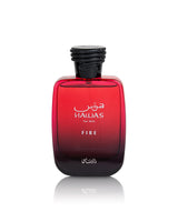 A bottle of hawas Fire For Him cologne, featuring a red gradient glass bottle with a black cap, shown on a white background with a soft reflection.