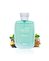 rasasi hawas tropical perfume bottle with floral elements like coconut and fig  on a white background
