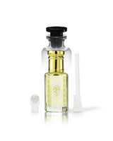 rawza perfume oil bottle with golden cap and gold neck detailing, filled with pale yellow liquid. A small white spray atomizer and a white applicator brush are placed beside it on a clean white background.