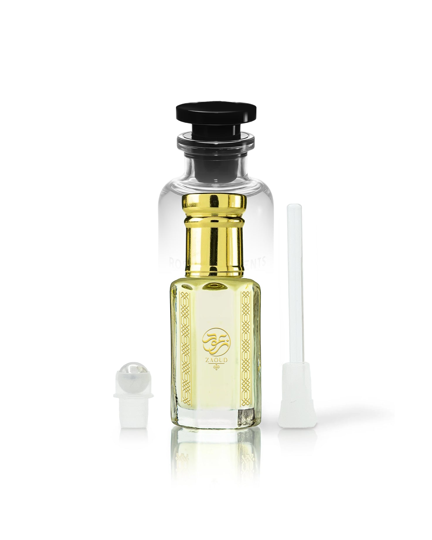 rawza perfume oil bottle with golden cap and gold neck detailing, filled with pale yellow liquid. A small white spray atomizer and a white applicator brush are placed beside it on a clean white background.