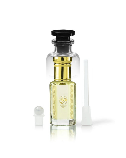 rawza perfume oil bottle with golden cap and gold neck detailing, filled with pale yellow liquid. A small white spray atomizer and a white applicator brush are placed beside it on a clean white background.