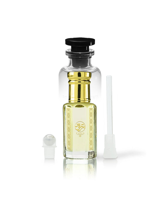 rawza perfume oil bottle with golden cap and gold neck detailing, filled with pale yellow liquid. A small white spray atomizer and a white applicator brush are placed beside it on a clean white background.