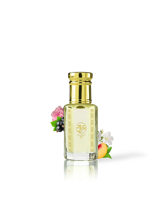 rawza perfume oil bottle with a shiny gold cap and gold decorative borders, filled with pale yellow liquid. The bottle is centered on a white background with a soft reflection below, and small decorative flowers and fruit are placed near the base.