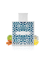 rayhaan azul perfume bottle surrounded by fragrance notes like lime and lemon shows against white background