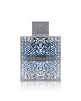Rayhaan aquatica PERFUME bottle with intricate silver filigree detailing and a blue patterned background, centered on a white reflective surface.