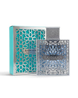 Rayhaan aquatica PERFUME bottle with a silver geometric patterned cap and base, shown next to its turquoise and silver packaging box on a white background.