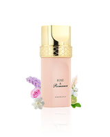 rose and romance by khadlaj perfume bottle surrounded with its ingredients like tuberose and bergamot with many more shows from behind the bottle against white background