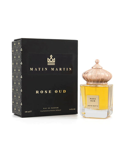 rose oud by matin martin perfume bottle shows beside its box against white background