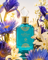 Sabah Al Ward Garden by Al Wataniah perfume bottle surrounded by blue lotus, iris, vanilla flowers and soft floral notes
