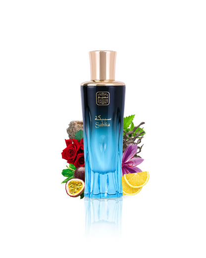 sabika aqua parfum by naseem perfume bottle surrounded with its ingredients like rose and passionfruit with many others shows from behind the bottle against white background