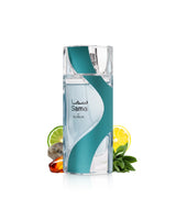 sama by nusuk blue transparent perfume bottle surrounded by fragrance notes like amber and sage shows from behind the bottle against white background