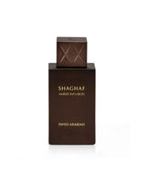 Brown perfume bottle labeled 'Shaghaf Amber Infusion' by Swiss Arabian on a white background